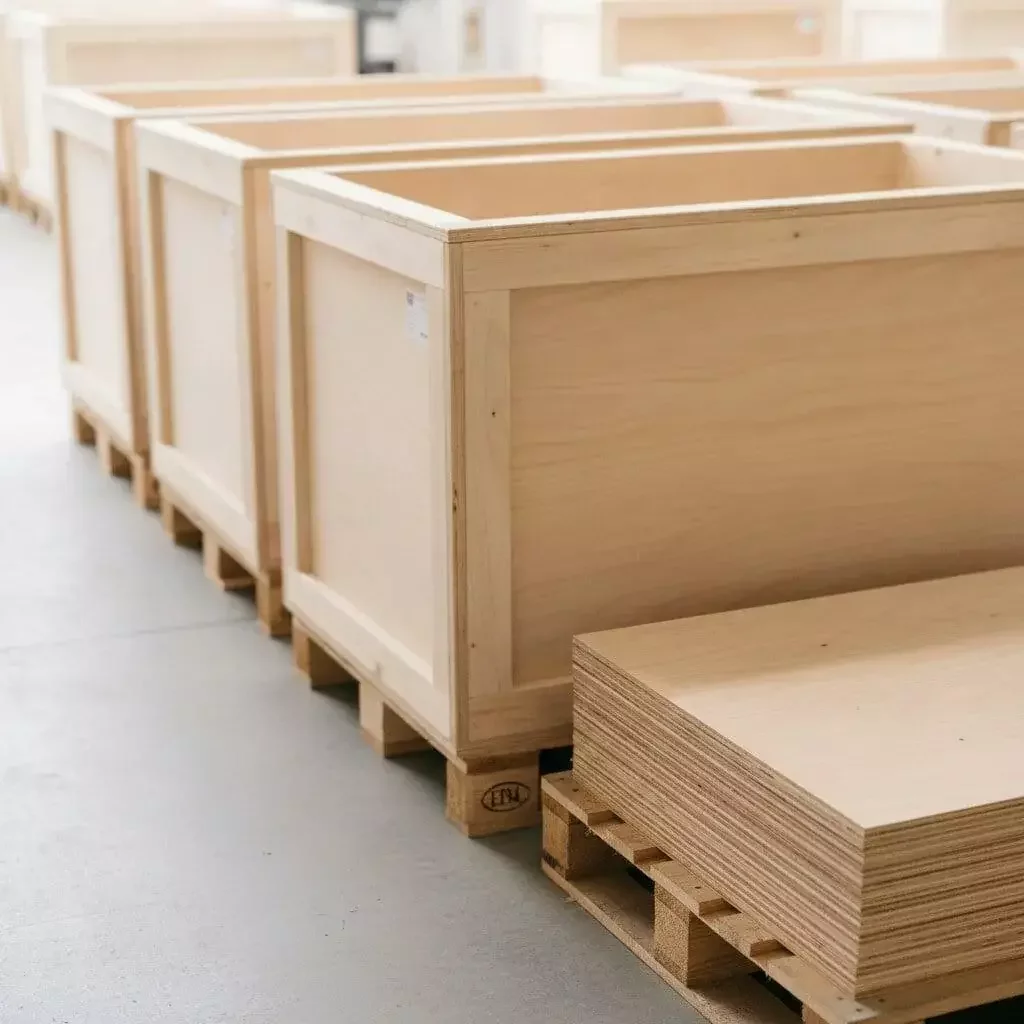 Industrial export crates and pallets stacked for a manufacturing client